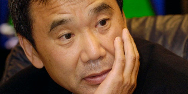 Japanese author Haruki Murakami listens to a question during an interview upon his arrival at Prague airport Ruzyne on Sunday, Oct. 29, 2006. Haruki Murakami, 57, is one of the outstanding contemporary Japanese writers. He gained popularity in Japan and worldwide with his novel Norwegian Wood. Murakami, one of the candidates for the Nobel Prize for Literature this year, will be awarded the Franz Kafka Prize at the Old Town Hall in Prague on Monday. (AP Photo/CTK, Stan Peska) ** SLOVAKIA OUT **