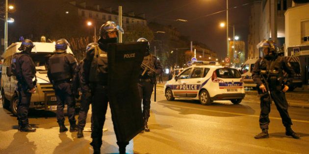 Police forces prepare in Paris, Wednesday, Nov. 18, 2015 after reports of a shooting in the northern suburb of St. Denis.(AP Photo/Francois Mori)