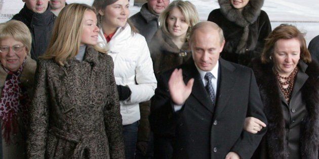 Russian President Vladimir Putin (C), his wife Ludmila (R) and daughter Maria (2ndL) enter a Moscow polling station, on December 2, 2007, to cast their votes in Russia's parliamentary elections. AFP PHOTO / ALEXANDER NEMENOV (Photo credit should read ALEXANDER NEMENOV/AFP/Getty Images)