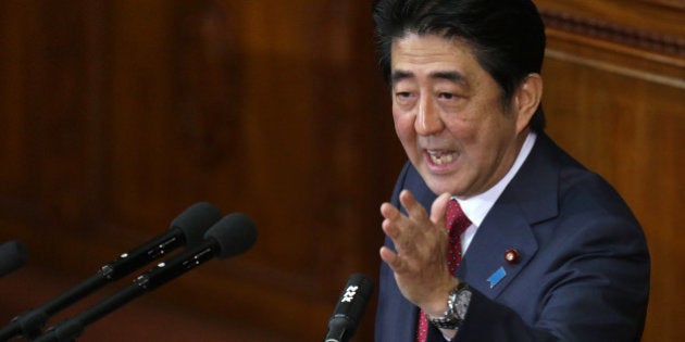 Shinzo Abe, Japan's prime minister, gestures as he delivers his policy speech at the lower house of parliament in Tokyo, Japan, on Thursday, Feb. 12, 2015. Abe said he will press ahead with biggest reforms since World War II. Photographer: Tomohiro Ohsumi/Bloomberg via Getty Images