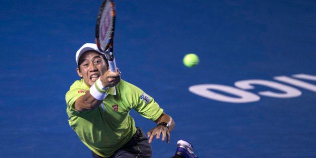 Kei Nishikori of Japan, returns the ball to David Ferrer of Spain, during the final of the men's singles of the Mexico Open tennis tournament in Acapulco, Saturday, Feb. 28, 2015. (AP Photo/Christian Palma)
