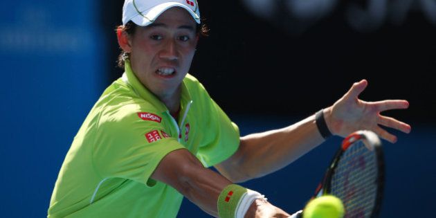 MELBOURNE, AUSTRALIA - JANUARY 28: Kei Nishikori of Japan plays a backhand in his quarterfinal match against Stanislas Wawrinka of Switzerland during day 10 of the 2015 Australian Open at Melbourne Park on January 28, 2015 in Melbourne, Australia. (Photo by Clive Brunskill/Getty Images)