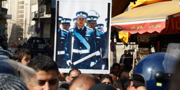 AMMAN, JORDAN - DECEMBER 26: People demonstrate against the ISIS capturing of Jordanian pilot Muath al Kasasbeh on December 26, 2014 in Amman, Jordan. Jordanians walked in support of the government's policies against ISIS and in the hope of saving the first capturing of a servicemen since Jordan joined the United States led coalition against the extremist group. (Photo by Jordan Pix/ Getty Images)