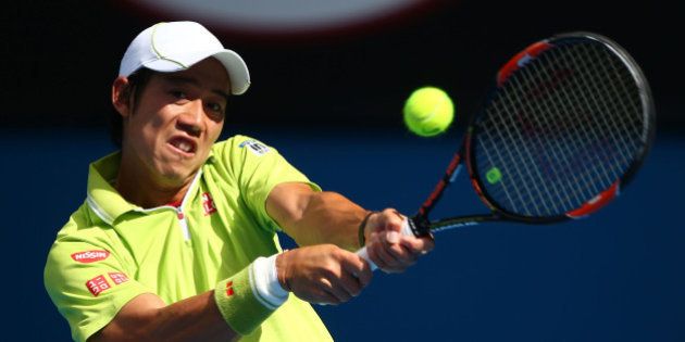 MELBOURNE, AUSTRALIA - JANUARY 26: Kei Nishikori of Japan plays a backhand in his fourth round match against David Ferrer of Spain during day eight of the 2015 Australian Open at Melbourne Park on January 26, 2015 in Melbourne, Australia. (Photo by Clive Brunskill/Getty Images)