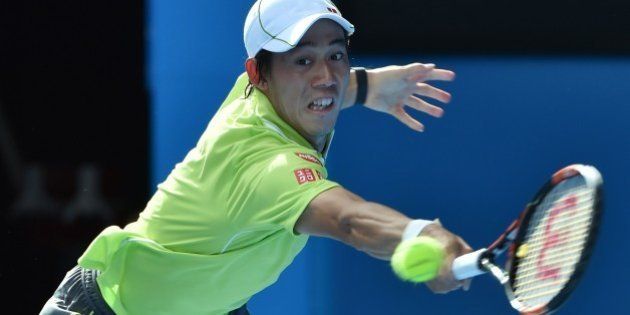 Kei Nishikori of Japan hits a return against David Ferrer of Spain in their men's singles match on day eight of the 2015 Australian Open tennis tournament in Melbourne on January 26, 2015. AFP PHOTO / PAUL CROCK-- IMAGE RESTRICTED TO EDITORIAL USE - STRICTLY NO COMMERCIAL USE (Photo credit should read PAUL CROCK/AFP/Getty Images)