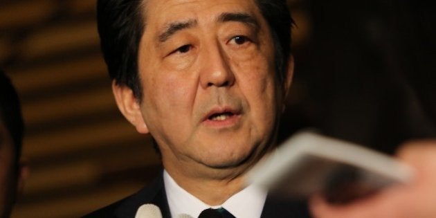 Japanese Prime Minister Shinzo Abe speakes to reporters after a cabinet meeting at his official residence in Tokyo on January 25, 2015. Japan's government said it was attempting to verify a video posted online announcing the execution of one of two Japanese hostages held captive by Islamic State militants. 'A new video apparently showing Kenji (Goto) was posted on the Internet,' chief government spokesman Yoshihide Suga said. 'We are collecting information'. AFP PHOTO / Yoshikazu TSUNO (Photo credit should read YOSHIKAZU TSUNO/AFP/Getty Images)