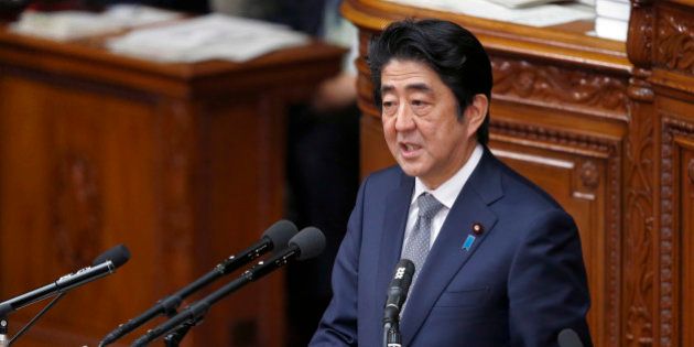 Japan's Prime Minister Shinzo Abe answers questions during a Diet session at the lower house of Parliament in Tokyo, Tuesday, Jan. 27, 2015. (AP Photo/Shizuo Kambayashi)