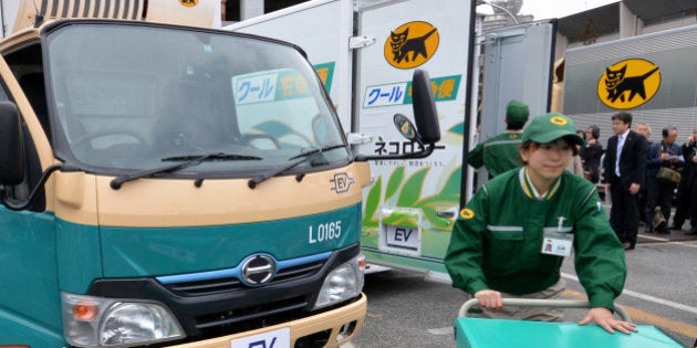 Japan's auto giant Toyota Motor and its subsidiary Hino Motors display the new electric trucks, a one-ton capacity and equipped with compartments to keep cool and frozen, in Tokyo on march 1, 2013. The EV truck, including its refrigator and freezer, is powered by Li-ion batteries, meaning it generates no emission during operation. Japan's delivery company Yamato Transport will start trial using of two EV trucks from middle of this month. AFP PHOTO / Yoshikazu TSUNO (Photo credit should read YOSHIKAZU TSUNO/AFP/Getty Images)