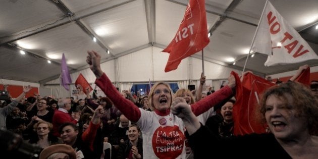 Anti-austerity Syriza supporters celebrate after the first exit polls, as they gather at the Syriza election kiosk in Athens on January 25, 2015. Radical left-wing party Syriza appeared to be heading for a clear victory in Greece's election, exit polls showed, which would allow it to challenge the course of austerity in Europe. Syriza took between 35.5 percent and 39.5 percent of the vote, according to the polls, compared to between 23 percent and 27 percent for the conservative New Democracy party of incumbent Prime Minister Antonis Samaras. AFP PHOTO / LOUISA GOULIAMAKI (Photo credit should read LOUISA GOULIAMAKI/AFP/Getty Images)