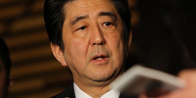 Japanese Prime Minister Shinzo Abe speakes to reporters after a cabinet meeting at his official residence in Tokyo on January 25, 2015. Japan's government said it was attempting to verify a video posted online announcing the execution of one of two Japanese hostages held captive by Islamic State militants. 'A new video apparently showing Kenji (Goto) was posted on the Internet,' chief government spokesman Yoshihide Suga said. 'We are collecting information'. AFP PHOTO / Yoshikazu TSUNO (Photo credit should read YOSHIKAZU TSUNO/AFP/Getty Images)