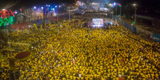 KUALA LUMPUR, MALAYSIA - AUGUST 30:Â Protestors listen to speeches during the Bersih 4.0 rally on August 30, 2015 in Kuala Lumpur, Malaysia. Prime Minister Najib Razak has become embroiled in a scandal involving state fund debts and allegations of deposits totaling 2.6 billion ringgit paid to his bank account. Razak has denied any wrongdoing. Thousands of people gathered to demand his resignation and a new general election. (Photo by Charles Pertwee/Getty Images)