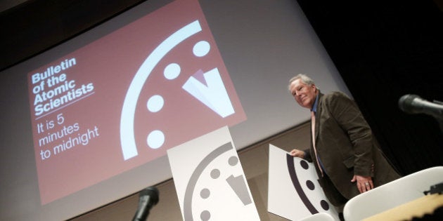 WASHINGTON, DC - JANUARY 22: Richard Somerville (R), research professor at Scripps Institution of Oceanography, unveils an updated version of the ÃDoomsday ClockÃ during a press conference held by the Bulletin of the Atomic Scientists January 22, 2015 in Washington, DC. The group moved the clock, considered a metaphor for the dangers facing the world, from 5 minutes to midnight to three minutes to midnight due in large part to growing concern over global climate change. Also pictured is Sivan Kartha (L), senior scientist at the Stockholm Environment Institute. (Photo by Win McNamee/Getty Images)