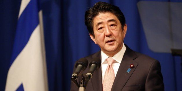 Japanese Prime Minister Shinzo Abe speaks during a press conference at a hotel in Jerusalem on January 20, 2015, demanding that the Islamic State group immediately free two Japanese hostages unharmed after the jihadists posted a video threat to kill them. The Islamic State group threatened to kill the two Japanese hostages unless Tokyo pays a $200 million ransom within 72 hours to compensate for non-military aid that Abe pledged to support the campaign against IS during an ongoing Middle East. AFP PHOTO / THOMAS COEX (Photo credit should read THOMAS COEX/AFP/Getty Images)