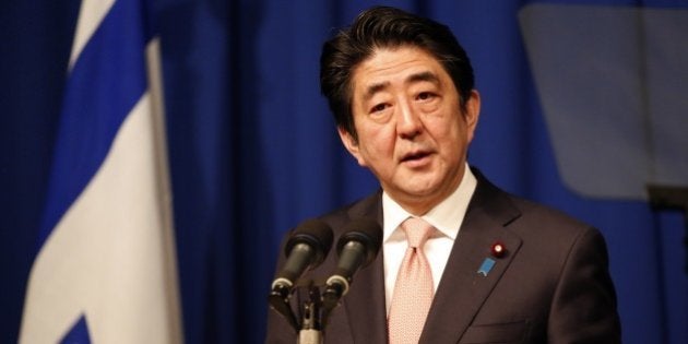 Japanese Prime Minister Shinzo Abe speaks during a press conference at a hotel in Jerusalem on January 20, 2015, demanding that the Islamic State group immediately free two Japanese hostages unharmed after the jihadists posted a video threat to kill them. The Islamic State group threatened to kill the two Japanese hostages unless Tokyo pays a $200 million ransom within 72 hours to compensate for non-military aid that Abe pledged to support the campaign against IS during an ongoing Middle East. AFP PHOTO / THOMAS COEX (Photo credit should read THOMAS COEX/AFP/Getty Images)