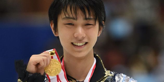 NAGANO, JAPAN - DECEMBER 27: Yuzuru Hanyu of Japan (Gold) poses with his gold medal in the award ceremony during the 83rd All Japan Figure Skating Championships at the Big Hat on December 27, 2014 in Nagano, Japan. (Photo by Atsushi Tomura/Getty Images)