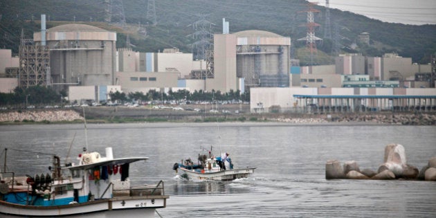 A fishing boat moves toward the Korea Hydro & Nuclear Power Co. (KHNP) Wolsong Nuclear Power Plant standing by the shore in Gyeongju, South Korea, on Tuesday, June 25, 2013. South Koreas government urged efforts to conserve electricity as the nation faces shortages following shutdowns in a nuclear power industry that supplies 30 percent of the nations generating capacity. Photographer: Jean Chung/Bloomberg via Getty Images