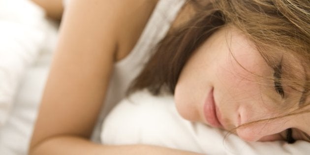 Young woman in bed, portrait