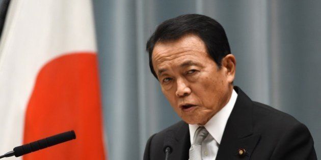 Japanese Finance and Deputy Prime Minister Taro Aso speaks during a press conference at the prime minister's official residence in Tokyo on September 3, 2014. Japanese Prime Minister Shinzo Abe named five female cabinet ministers on September 3, leading by example in a country which economists say must make better use of its highly-educated but underemployed women. AFP PHOTO / TOSHIFUMI KITAMURA (Photo credit should read TOSHIFUMI KITAMURA/AFP/Getty Images)