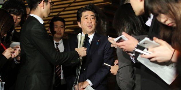 Japanese Prime Minister Shinzo Abe speakes to reporters after a cabinet meeting at his official residence in Tokyo on January 25, 2015. Japan's government said it was attempting to verify a video posted online announcing the execution of one of two Japanese hostages held captive by Islamic State militants. 'A new video apparently showing Kenji (Goto) was posted on the Internet,' chief government spokesman Yoshihide Suga said. 'We are collecting information'. AFP PHOTO / Yoshikazu TSUNO (Photo credit should read YOSHIKAZU TSUNO/AFP/Getty Images)