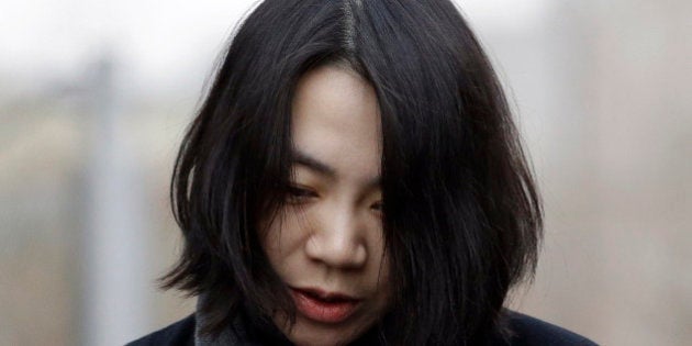 Cho Hyun-ah, who was head of cabin service at Korean Air and the oldest child of Korean Air chairman Cho Yang-ho, speaks to the media upon her arrival for questioning at the Aviation and Railway Accident Investigation Board office of Ministry of Land, Infrastructure and Transport in Seoul, South Korea, Friday, Dec. 12, 2014. The chairman of Korean Air Lines Co. apologized Friday for the behavior of his adult daughter who delayed a flight in an incident now dubbed