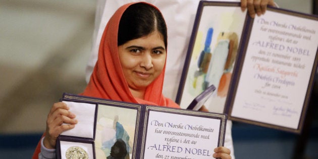 Nobel Peace Prize winners Malala Yousafzai from Pakistan, front, and Kailash Satyarthi of India are awarded their Nobel Peace Prize during the Nobel Peace Prize award ceremony in Oslo, Norway, Wednesday, Dec. 10, 2014. The Nobel Peace Prize is being shared between Malala Yousafzai, the 17-year-old Taliban attack survivor, and the youngest Nobel Prize winner ever, and Indian children's rights activist Kailash Satyarthi in a ceremony in Oslo on Wednesday. (AP Photo/Matt Dunham)