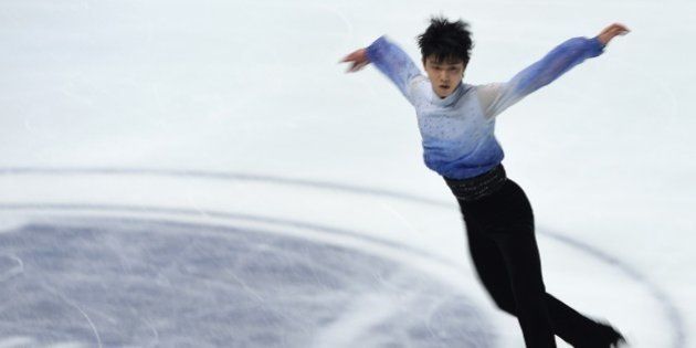 Yuzuru Hanyu of Japan performs during the men's singles short program at the NHK Trophy ISU Grand Prix figure skating 2014 in Osaka on November 28, 2014. AFP PHOTO / TOSHIFUMI KITAMURA (Photo credit should read TOSHIFUMI KITAMURA/AFP/Getty Images)