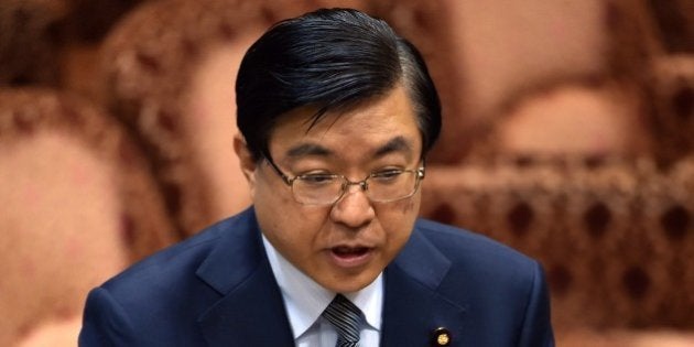 Yosuke Isozaki, special adviser to Prime Minister Shinzo Abe, answers a question from an opposition lawmaker at the Upper House's ad hoc committee for the security bills at the National Diet in Tokyo on August 3, 2015. Isozaki offered an apology for remarks he made that played down the compatibility of the national security bills with Japan's constitution. AFP PHOTO / Yoshikazu TSUNO (Photo credit should read YOSHIKAZU TSUNO/AFP/Getty Images)