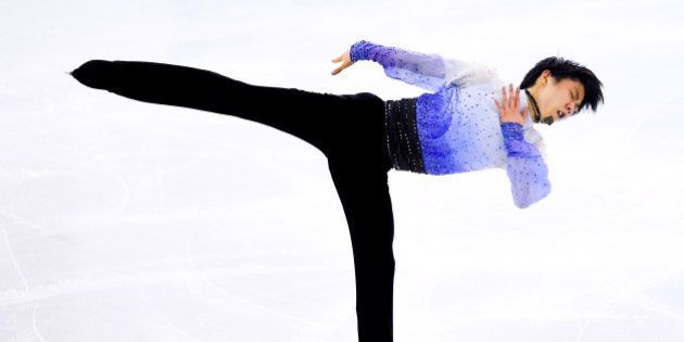 BARCELONA, SPAIN - DECEMBER 12: Yuzuru Hanyu of Japan compete in the Short Program Final during day two of the ISU Grand Prix of Figure Skating Final 2014/2015 at Barcelona International Convention Centre on December 12, 2014 in Barcelona, Spain. (Photo by David Ramos/Getty Images)