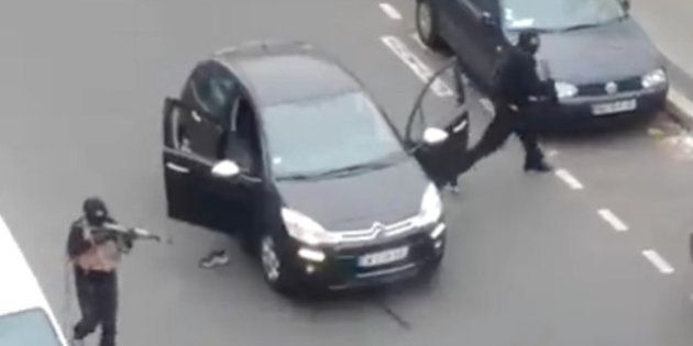A police officer pleads for mercy on the pavement before being shot in the head by masked gunmen during an attack on the headquarters of the French satirical newspaper Charlie Hebdo in Paris, France, on January 7, 2015. Gunmen have attacked the Paris office of French satirical magazine Charlie Hebdo, killing 12 people and injuring seven, French officials say. At least two masked attackers opened fire with assault rifles in the office and exchanged shots with police in the street outside before escaping by car. President Francois Hollande said there was no doubt it had been a terrorist attack