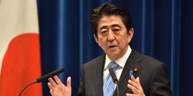 Japan's Prime Minister Shinzo Abe speaks during a press conference at his official residence in Tokyo on November 18, 2014. Abe said November 18 he was delaying an expected sales tax rise and dissolving the lower house of parliament after figures showed Japan was in a recession. AFP PHOTO / KAZUHIRO NOGI (Photo credit should read KAZUHIRO NOGI/AFP/Getty Images)