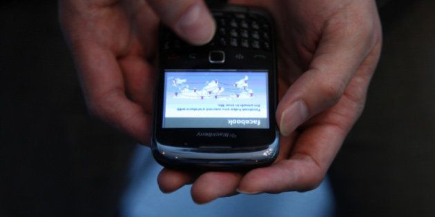 The Facebook Inc. website is displayed on a Research In Motion Ltd. (RIM) Blackberry 9900 smartphone in this arranged photograph in Tokyo, Japan, on Wednesday, May 16, 2012. Facebook Inc. is boosting the number of shares for sale in its initial public offering to 421 million, letting it raise as much as $16 billion, two people with knowledge of the deal said. Photographer: Tomohiro Ohsumi/Bloomberg via Getty Images