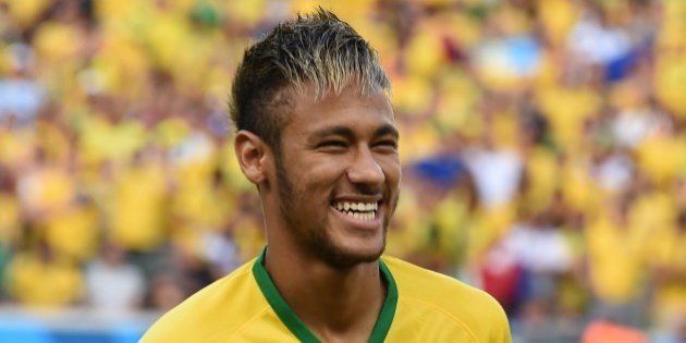 Brazil's forward Neymar smiles before the quarter-final football match between Brazil and Colombia at the Castelao Stadium in Fortaleza during the 2014 FIFA World Cup on July 4, 2014. AFP PHOTO / VANDERLEI ALMEIDA (Photo credit should read VANDERLEI ALMEIDA/AFP/Getty Images)