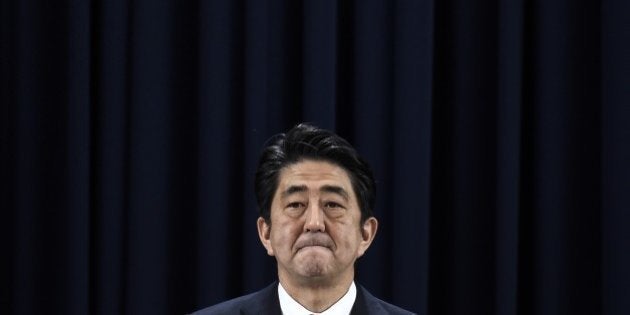 Japan's Prime Minister Shinzo Abe gives a press conference during the Asia-Pacific Economic Cooperation (APEC) summit in Beijing on November 11, 2014. Top leaders and ministers of the 21-member APEC grouping are meeting in Beijing from November 7 to 11. AFP PHOTO / FRED DUFOUR (Photo credit should read FRED DUFOUR/AFP/Getty Images)