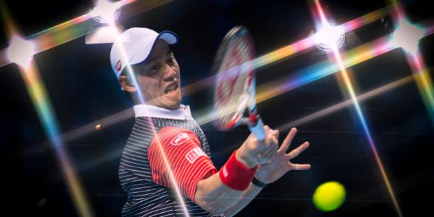 LONDON, ENGLAND - NOVEMBER 13: (EDITORS NOTE: This image was created using an in camera multiple exposure with a star filter on the lens) Kei Nishikori of Japan plays a forehand in the round robin singles match against David Ferrer of Spain on day five of the Barclays ATP World Tour Finals at O2 Arena on November 13, 2014 in London, England. (Photo by Justin Setterfield/Getty Images)