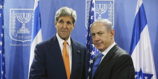 US Secretary of State John Kerry (L) shakes hands with Israeli Prime Minister Benjamin Netanyahu in Tel Aviv on July 23, 2014. Kerry is meeting with United Nations Secretary-General Ban Ki-moon, Netanyahu, and Palestinian president Mahmud Abbas as efforts for a cease-fire between Hamas and Israel continues. AFP PHOTO / POOL (Photo credit should read POOL/AFP/Getty Images)