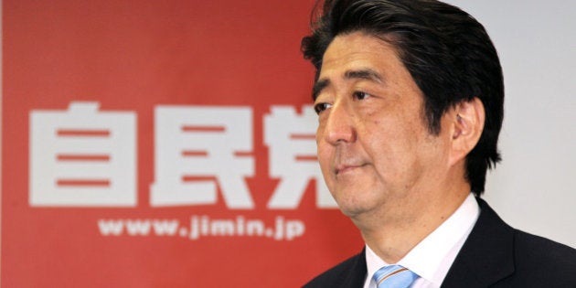 Shinzo Abe, Japan's prime minister and president of the Liberal Democratic Party (LDP), attends a news conference following a victory in the upper house elections at the LDP headquarters in Tokyo, Japan, on Monday, July 22, 2013. Abe's ruling coalition faces the challenge of maintaining unity and public support after cementing control of both houses of parliament on a platform of economic revival. Photographer: Koichi Kamoshida/Bloomberg via Getty Images