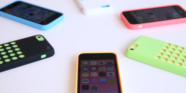 CUPERTINO, CA - SEPTEMBER 10: The new iPhone 5C is displayed during an Apple product announcement at the Apple campus on September 10, 2013 in Cupertino, California. The company launched the new iPhone 5C model that will run iOS 7 is made from hard-coated polycarbonate and comes in various colors and the iPhone 5S that features fingerprint recognition security. (Photo by Justin Sullivan/Getty Images)