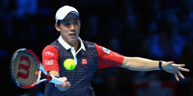 LONDON, ENGLAND - NOVEMBER 11: Kei Nishikori of Japan plays a shot in the round robin singles match against Roger Federer of Switzerland on day three of the Barclays ATP World Tour Finals at the O2 Arena on November 11, 2014 in London, England. (Photo by Clive Brunskill/Getty Images)