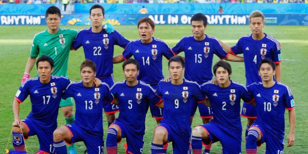 CUIABA, BRAZIL - JUNE 24: Japan players pose for a team photo during the 2014 FIFA World Cup Brazil Group C match between Japan and Colombia at Arena Pantanal on June 24, 2014 in Cuiaba, Brazil. (Photo by Gabriel Rossi/Getty Images)
