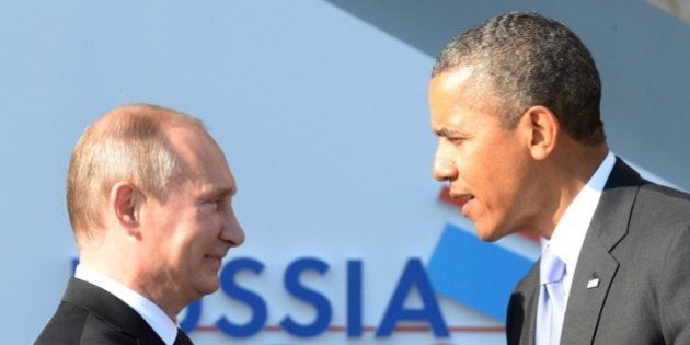 Russias President Vladimir Putin (L) welcomes US President Barack Obama at the start of the G20 summit on September 5, 2013 in Saint Petersburg. Russia hosts the G20 summit hoping to push forward an agenda to stimulate growth but with world leaders distracted by divisions on the prospect of US-led military action in Syria. AFP PHOTO / YURI KADOBNOV (Photo credit should read YURI KADOBNOV/AFP/Getty Images)