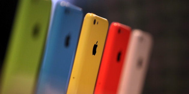 CUPERTINO, CA - SEPTEMBER 10: The new iPhone 5C is displayed during an Apple product announcement at the Apple campus on September 10, 2013 in Cupertino, California. The company launched the new iPhone 5C model that will run iOS 7 is made from hard-coated polycarbonate and comes in various colors and the iPhone 5S that features fingerprint recognition security. (Photo by Justin Sullivan/Getty Images)