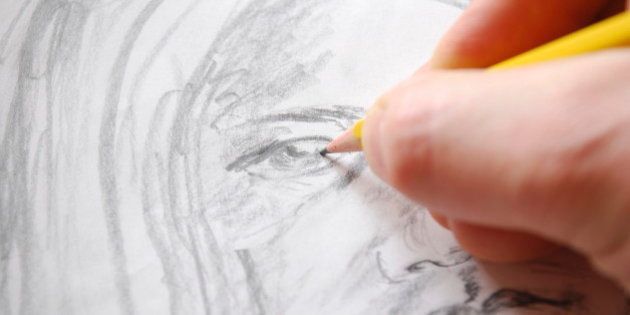 A hand is drawing A portrait of a girl.