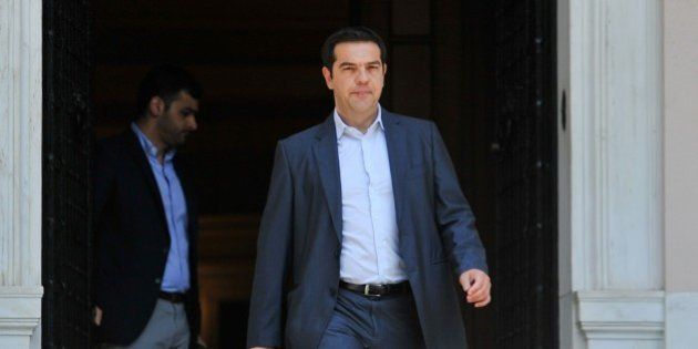 Greece's Prime Minister Alexis Tsipras leaves Maximos Mansion in Athens, Thursday, July 9, 2015. Greece's government was racing Thursday to finalize a plan of reforms for its third bailout, hoping this time the proposal will meet with approval from its European partners and stave off a potentially catastrophic exit from Europe's joint currency, the euro, within days. (Giannis Kotsiaris/InTime News via AP) GREECE OUT