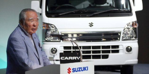 Osamu Suzuki, chairman, president and chief executive officer of Suzuki Motor Corp., speaks at the unveiling of the company's Carry mini-truck in Tokyo, Japan, on Thursday, Aug. 29, 2013. Nissan Motor Co. will sign original equipment manufacturer, or OEM, agreement on mini commercial vehicles and a wagon-type minicar with Suzuki, according to a statement on Nissa website. Photographer: Tomohiro Ohsumi/Bloomberg via Getty Images