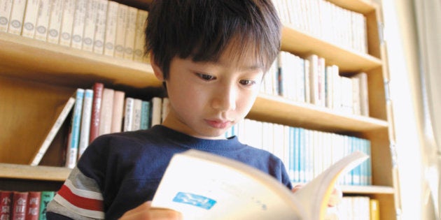 Boy reading a book