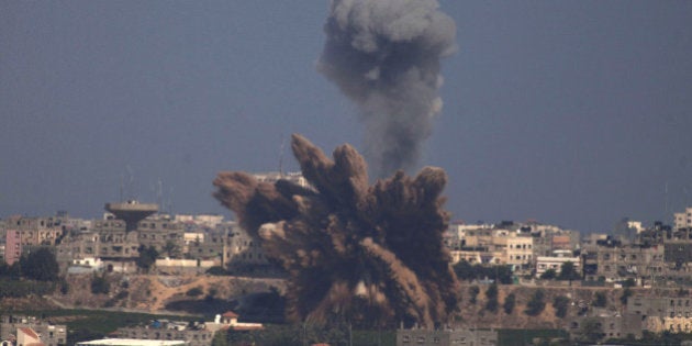 SDEROT, ISRAEL - JULY 09: (ISRAEL OUT) A plume of smoke rises over Gaza following an Israel Air Force bombing, as seen from near Sderot on July 9, 2014 in Israel. Due to recent escalation in the region, the Israeli army started new deployments at the border with the Gaza Strip. In the past 3 weeks more than 130 rockets where reportedly fired from Gaza into Israel. (Photo by Lior Mizrahi/Getty Images)