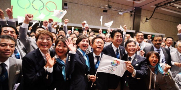 BUENOS AIRES, ARGENTINA - SEPTEMBER 07: Tokyo 2020 CEO Masato Mizuno (2R), Prime Minister of Japan Shinzo Abe (3R), Governor of Tokyo, Naoki Inose (C) and 'Cool Tokyo' Ambassador Christel Takigawa (3L) celebrate as Tokyo is awarded the 2020 Summer Olympic Gamesduring the 125th IOC Session - 2020 Olympics Host City Announcement at Hilton Hotel on September 7, 2013 in Buenos Aires, Argentina. (Photo by Ian Walton/Getty Images)