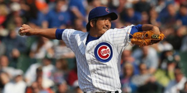 CHICAGO, IL - MAY 17: Kyuji Fujikawa #11 of the Chicago Cubs pitches against the New York Mets at Wrigley...