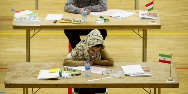 Young math geniuses take part on July 19, 2011 in the International Mathematical Olympiad in Amsterdam, a math competition for high school students. A total of nearly 600 youths from 103 different countries are participating in the competition. AFP PHOTO / VALERIE KUYPERS - netherlands out - belgium out - (Photo credit should read VALERIE KUYPERS/AFP/Getty Images)