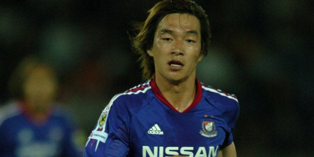 YOKOHAMA, JAPAN - MAY 12: (EDITORIAL USE ONLY) Daisuke Oku of Yokohama F. Marinos in action during the J.League Division 1 first stage match between Yokohama F. Marinos and Shimizu S-Pulse at Yokohama International Stadium on May 12, 2004 in Yokohama, Kanagawa, Japan. (Photo by Etsuo Hara/Getty Images)